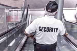 security, man, escalator, police, guard, officer, surveillance, control, monitoring, safety, uniform, back view, security, security, security, security, security, police, safety